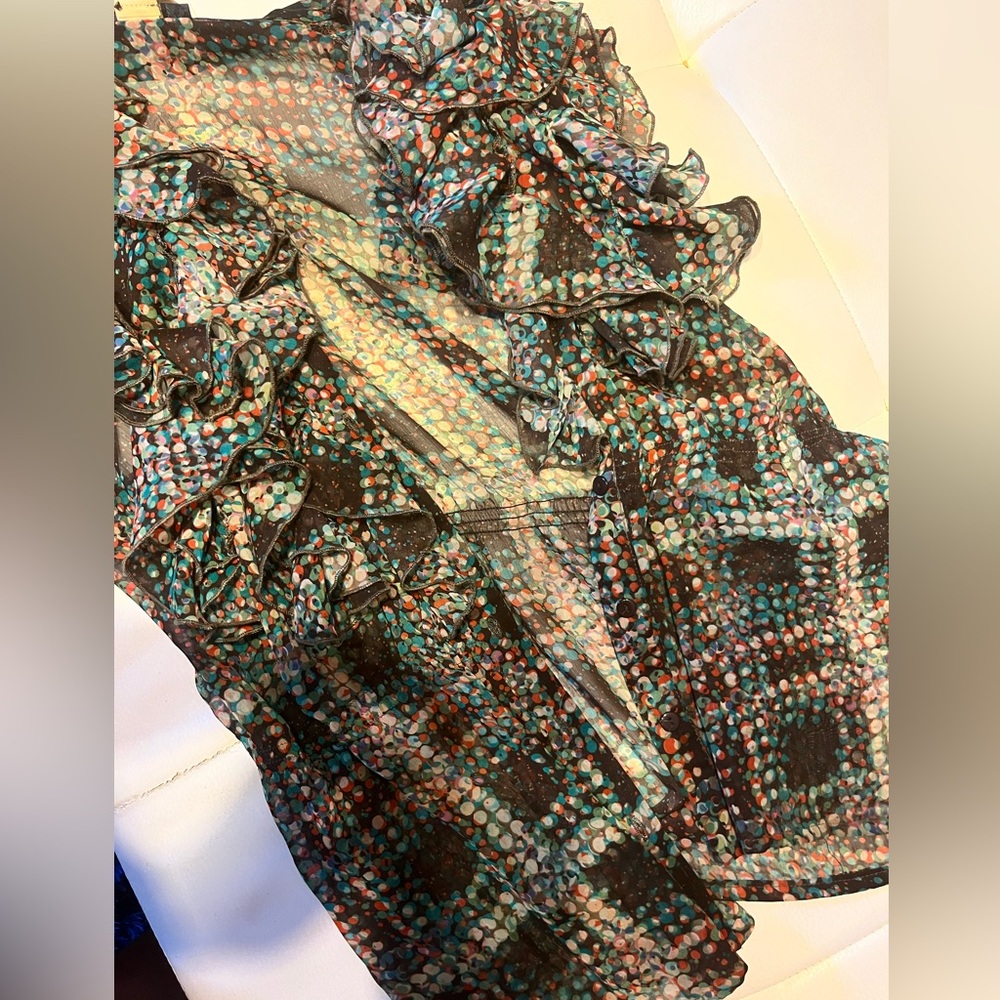 Nice dress up or down multicolor sleeveless blouse.